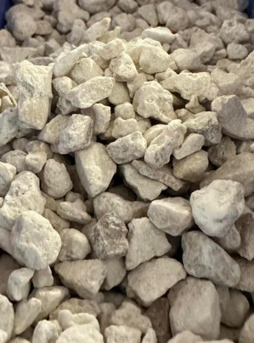 Close up of inexpensive millings driveway pebbles.